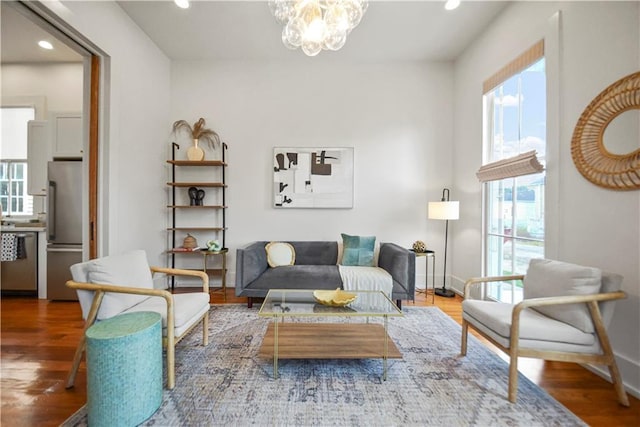 3311 Saint Ann St, New Orleans, LA 70119 - living room with recessed lighting, wood finished floors, and a chandelier