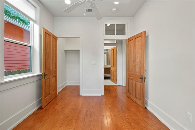 3311 Saint Ann St, New Orleans, LA 70119 - unfurnished bedroom featuring light wood finished floors and a ceiling fan
