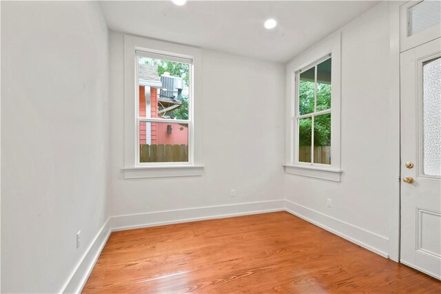 3311 Saint Ann St, New Orleans, LA 70119 - empty room with light wood-style flooring and healthy amount of natural light