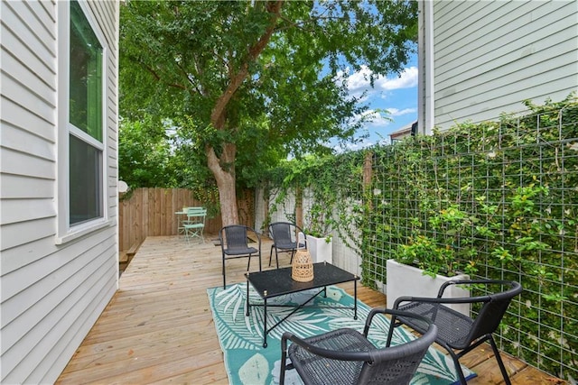 3311 Saint Ann St, New Orleans, LA 70119 - wooden terrace with a fenced backyard