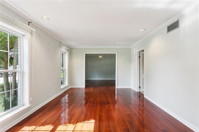 5033 Bissonet Dr, Metairie, LA 70003 - spare room with healthy amount of natural light, hardwood / wood-style floors, crown molding, and recessed lighting