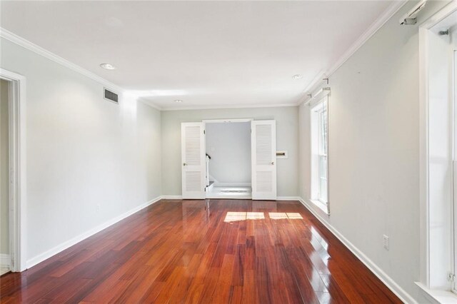 5033 Bissonet Dr, Metairie, LA 70003 - spare room with wood-type flooring and ornamental molding