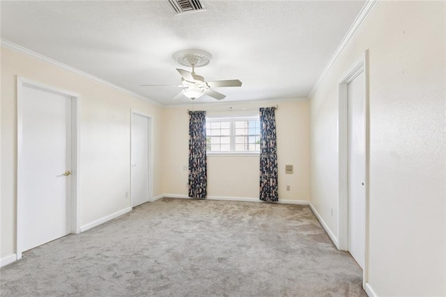 5033 Bissonet Dr, Metairie, LA 70003 - unfurnished bedroom featuring crown molding, carpet flooring, a textured ceiling, and a ceiling fan