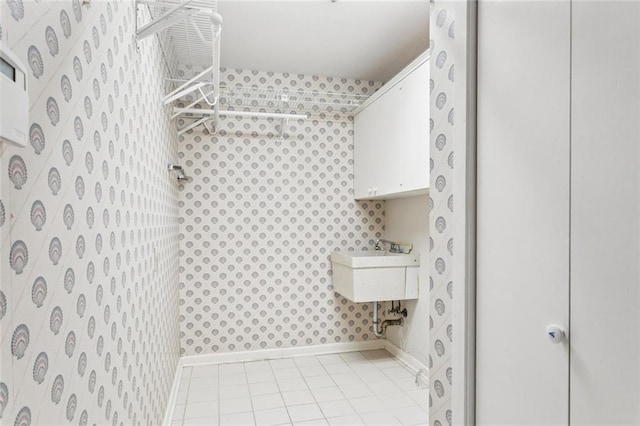 5033 Bissonet Dr, Metairie, LA 70003 - bathroom with wallpapered walls and tile patterned floors
