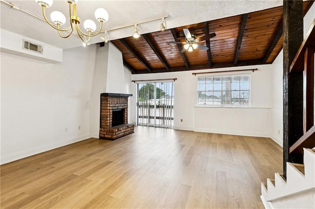 2305 Cleary Ave Unit 214, Metairie, LA 70001 - unfurnished living room featuring ceiling fan, wood ceiling, wood finished floors, a fireplace, and a chandelier