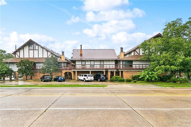 2305 Cleary Ave Unit 214, Metairie, LA 70001 - view of property featuring uncovered parking