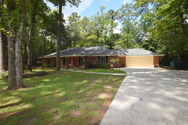 1005 Oakland Dr, Pearl River, LA 70452 - single story home with concrete driveway, a front lawn, brick siding, and an attached garage