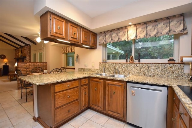 1005 Oakland Dr, Pearl River, LA 70452 - kitchen featuring dishwasher, brown cabinets, a peninsula, light tile patterned flooring, and light stone counters