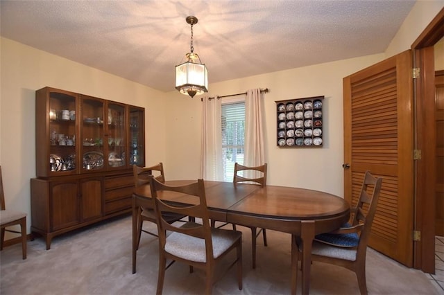 1005 Oakland Dr, Pearl River, LA 70452 - dining room featuring a textured ceiling and light carpet