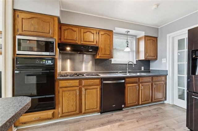 822 Homestead Ave, Metairie, LA 70005 - kitchen with black appliances, brown cabinetry, a warming drawer, and ornamental molding