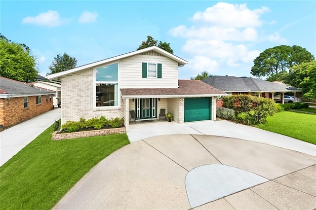 822 Homestead Ave, Metairie, LA 70005 - view of front of home with driveway, an attached garage, a front yard, and brick siding