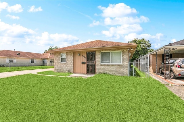 452426 Lafon Dr, New Orleans, LA 70126 - bungalow-style house featuring brick siding and a carport