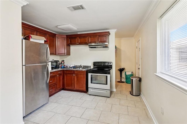 452426 Lafon Dr, New Orleans, LA 70126 - kitchen featuring stainless steel appliances, under cabinet range hood, plenty of natural light, ornamental molding, and light tile patterned floors