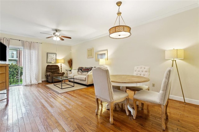 800 Rue Burgundy St Unit 223, Metairie, LA 70005 - dining room with ceiling fan, ornamental molding, and light wood-type flooring