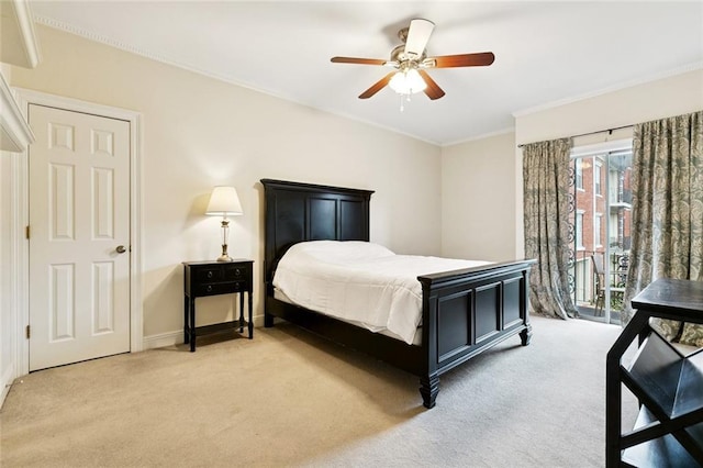800 Rue Burgundy St Unit 223, Metairie, LA 70005 - bedroom featuring light carpet, access to outside, ornamental molding, and ceiling fan