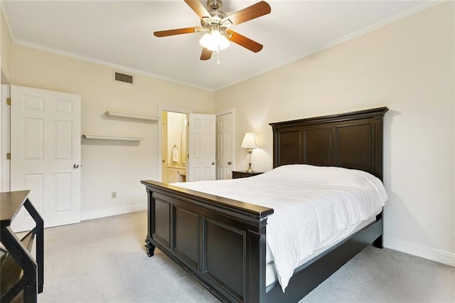 800 Rue Burgundy St Unit 223, Metairie, LA 70005 - bedroom with light carpet, connected bathroom, ornamental molding, and a ceiling fan
