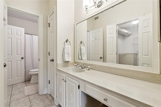 800 Rue Burgundy St Unit 223, Metairie, LA 70005 - bathroom featuring a closet, vanity, and tile patterned flooring