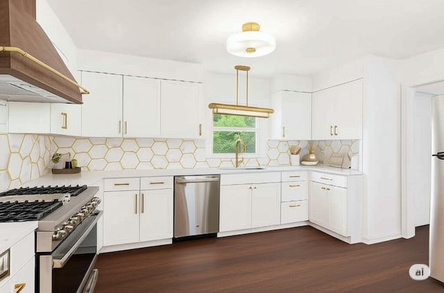 6213 Rosalie Ct, Metairie, LA 70003 - kitchen with appliances with stainless steel finishes, custom range hood, light countertops, and dark wood-type flooring