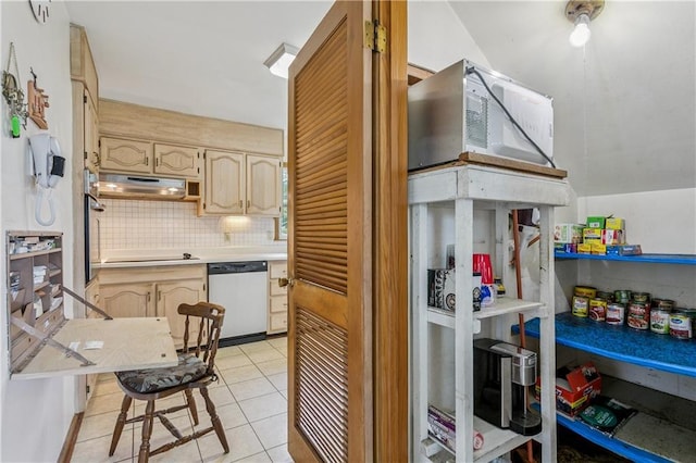 6213 Rosalie Ct, Metairie, LA 70003 - kitchen featuring stainless steel appliances, light countertops, decorative backsplash, under cabinet range hood, and light tile patterned floors