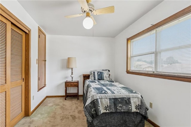 6213 Rosalie Ct, Metairie, LA 70003 - bedroom with light colored carpet, a closet, and ceiling fan