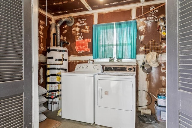 6213 Rosalie Ct, Metairie, LA 70003 - laundry room with strapped water heater and washer and clothes dryer