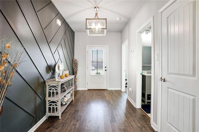 801 Lakeshore Village Dr, Slidell, LA 70461 - entryway featuring a chandelier and dark wood-style flooring