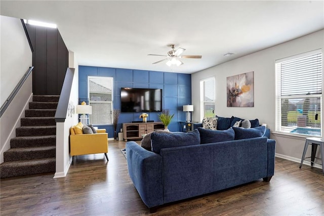 801 Lakeshore Village Dr, Slidell, LA 70461 - living room with stairs, healthy amount of natural light, ceiling fan, and dark wood-type flooring