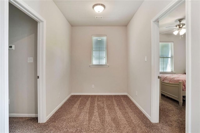 801 Lakeshore Village Dr, Slidell, LA 70461 - empty room featuring carpet floors and a ceiling fan