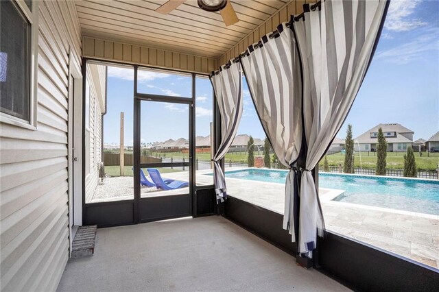 801 Lakeshore Village Dr, Slidell, LA 70461 - unfurnished sunroom with ceiling fan and a residential view
