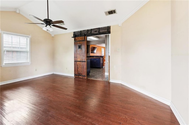 501 Oriole St, Metairie, LA 70006 - empty room featuring hardwood / wood-style flooring, a ceiling fan, ornamental molding, a barn door, and lofted ceiling
