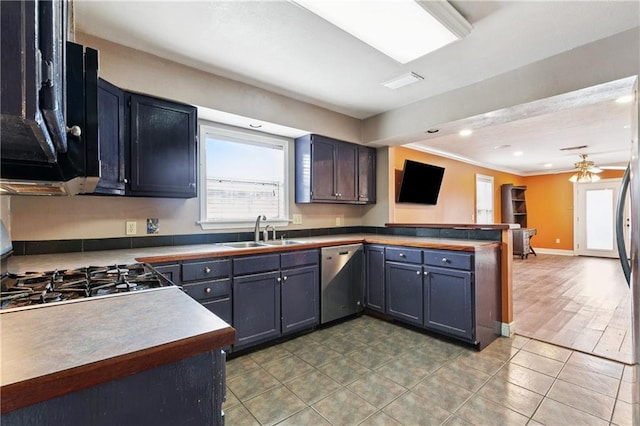 501 Oriole St, Metairie, LA 70006 - kitchen featuring stainless steel dishwasher, a peninsula, healthy amount of natural light, open floor plan, and ornamental molding