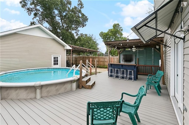 501 Oriole St, Metairie, LA 70006 - view of swimming pool featuring a wooden deck, a fenced backyard, and ceiling fan