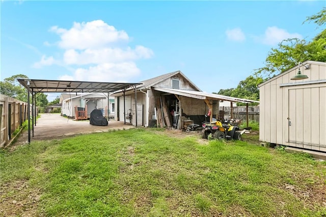 501 Oriole St, Metairie, LA 70006 - back of house with a storage shed and a carport