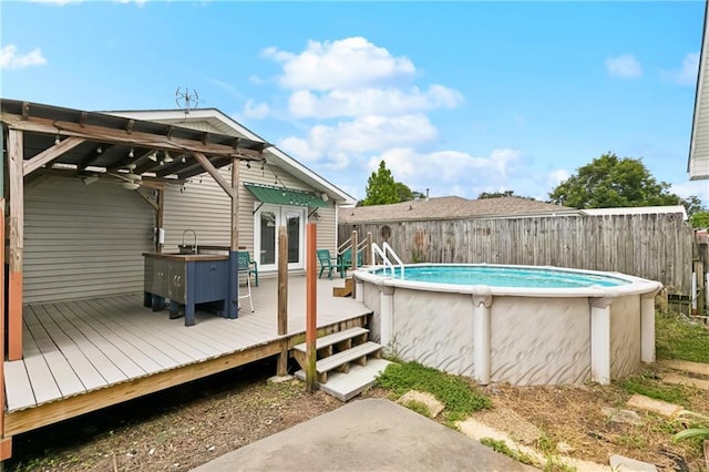 501 Oriole St, Metairie, LA 70006 - view of swimming pool featuring a wooden deck and a fenced backyard