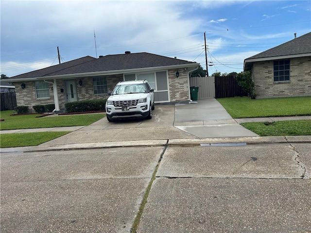 532 Deerfield Rd, Terrytown, LA 70056 - view of front of house with brick siding, concrete driveway, and a shingled roof