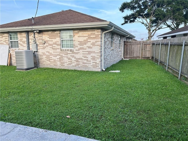532 Deerfield Rd, Terrytown, LA 70056 - rear view of property featuring a fenced backyard, brick siding, and roof with shingles