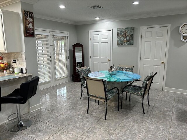 532 Deerfield Rd, Terrytown, LA 70056 - dining area featuring recessed lighting, crown molding, and french doors