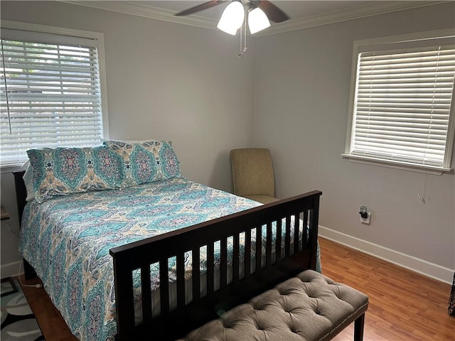 532 Deerfield Rd, Terrytown, LA 70056 - bedroom featuring crown molding, wood finished floors, and a ceiling fan