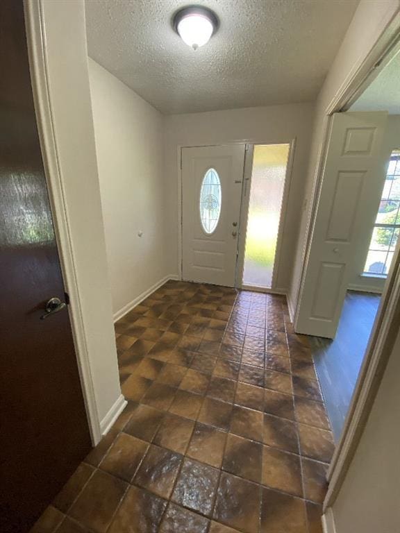 1411 Patriot St, Slidell, LA 70458 - foyer entrance with healthy amount of natural light and a textured ceiling