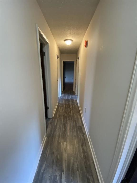 1411 Patriot St, Slidell, LA 70458 - corridor featuring dark wood finished floors and baseboards