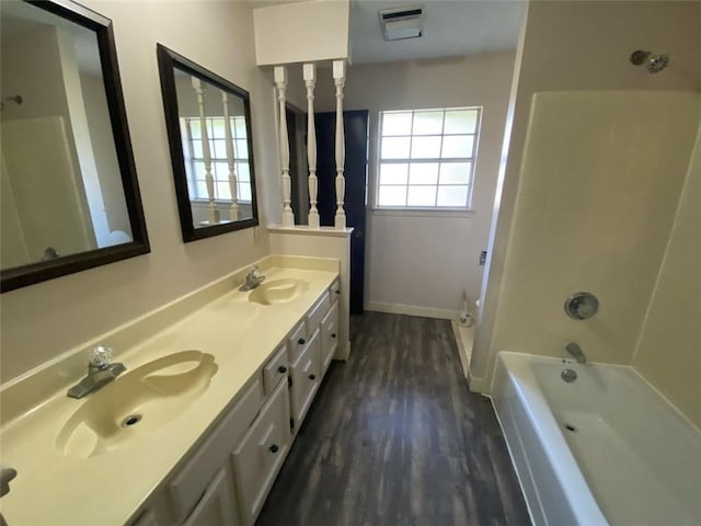 1411 Patriot St, Slidell, LA 70458 - bathroom with wood finished floors and double vanity