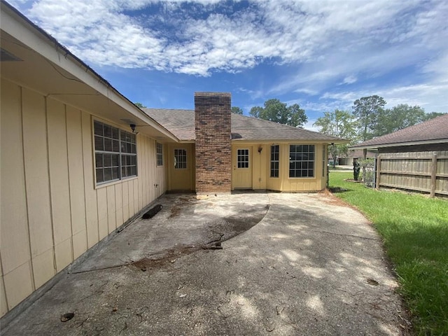 1411 Patriot St, Slidell, LA 70458 - rear view of property featuring a patio and a chimney