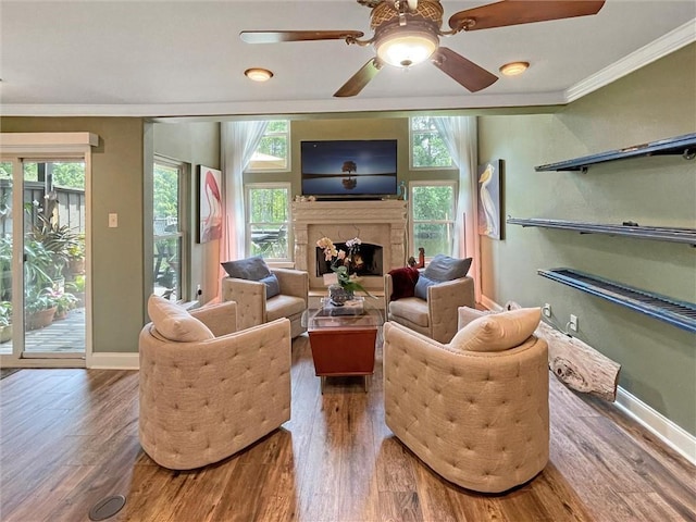60 Chamale Cv Unit 60, Slidell, LA 70460 - living area with ornamental molding, wood finished floors, a lit fireplace, and ceiling fan