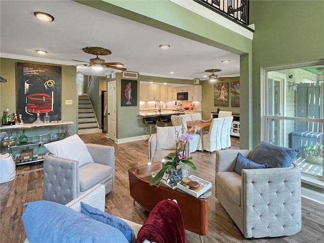 60 Chamale Cv Unit 60, Slidell, LA 70460 - living room featuring ceiling fan, stairway, wood finished floors, ornamental molding, and recessed lighting