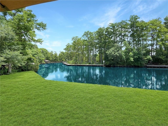 60 Chamale Cv Unit 60, Slidell, LA 70460 - view of pool featuring a lawn and a water view