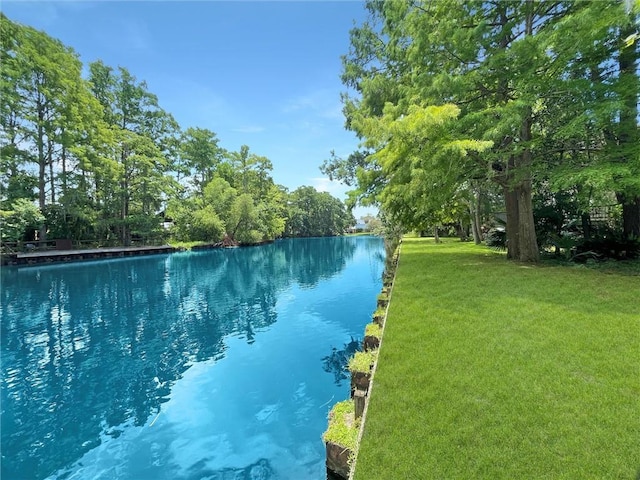 60 Chamale Cv Unit 60, Slidell, LA 70460 - view of swimming pool with a yard and a water view
