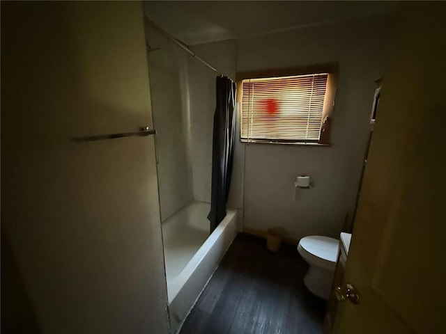 5013 Douglas Ave, Baton Rouge, LA 70805 - full bathroom featuring vanity, wood finished floors, and shower / bath combo with shower curtain