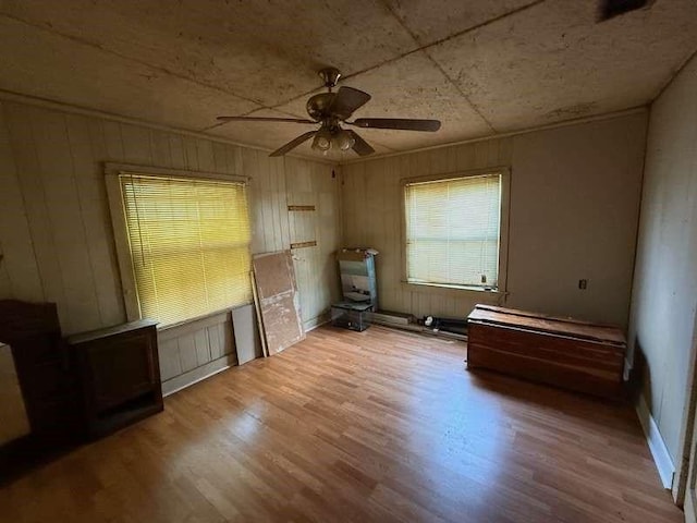 5013 Douglas Ave, Baton Rouge, LA 70805 - unfurnished bedroom featuring wood finished floors, a ceiling fan, and wood walls