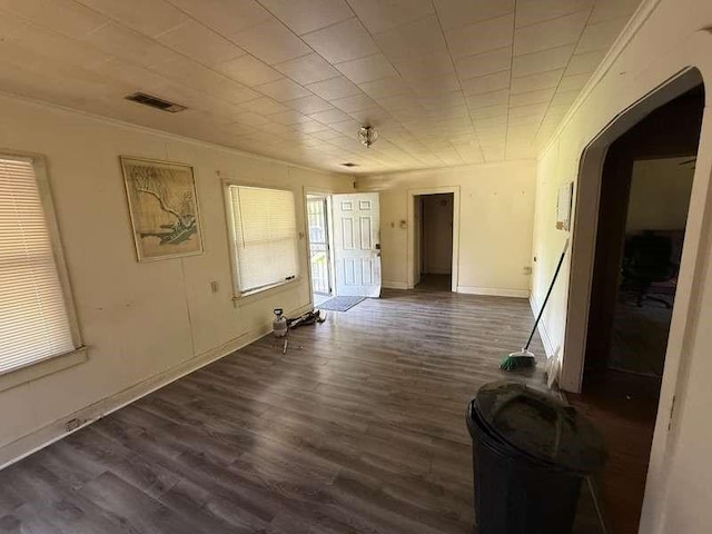 5013 Douglas Ave, Baton Rouge, LA 70805 - empty room with arched walkways, dark wood finished floors, and crown molding