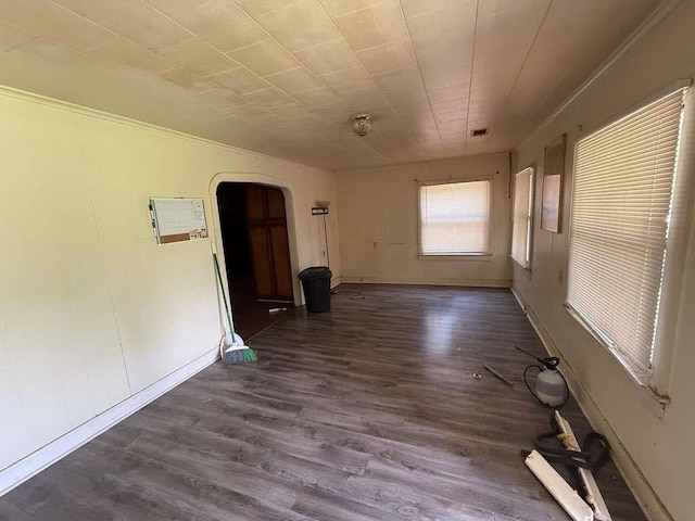 5013 Douglas Ave, Baton Rouge, LA 70805 - spare room with arched walkways and dark wood-style floors